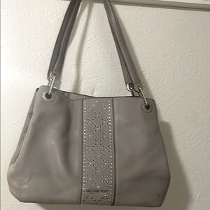 Elegant  Micheal Kors Gray Studded Handbag, preowned and been used some times.